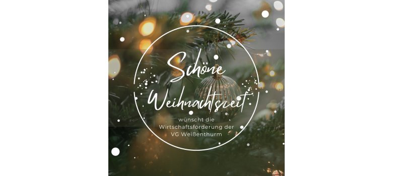 Vor einer Nahaufnahme einer silbernen Kugel, die an einem Weihnachtsbaum hängt und mit Lichtern umgeben ist, steht in weißer Schrift in einem Kreis: Schöne Weihnachtszeit wünscht die Wirtschaftsförderung der VG Weißenthurm.